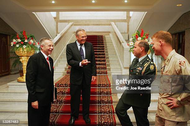 Secretary of Defense Donald Rumsfeld shares a light moment with the U.S. Ambassador Richard Hoagland and others July 26, 2005 in Dushanbe,...