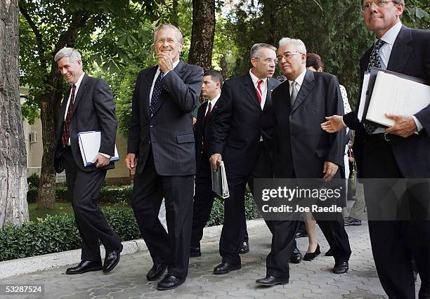 Secretary of Defense Donald Rumsfeld walks with U.S. Ambassador Richard Hoagland, and Tajikistan Minister of Foreign Affairs, Talbak Nazarov after a...