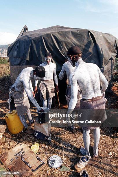 South Africa, Eastern Cape, young Xhosa men undergoing Ulwaluko, the traditional manhood initiation ritual in their bush camp.