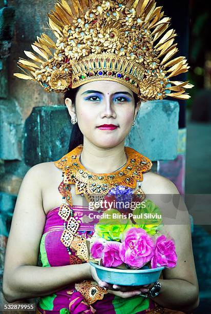 Bali, Indonesia.2013 april An Indonesian Woman wears a traditional dress and headpiece in Bali