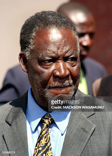 Zambian opposition Patriotic Front leader Michael Sata is led to Lusaka Central Prison by policemen after he appeared court 26 July 2005. It is...