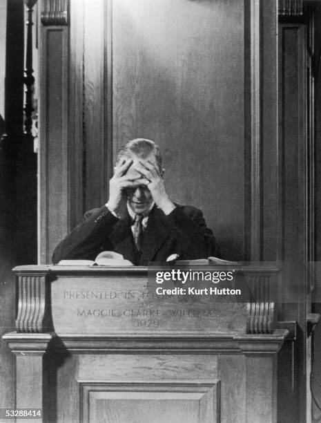 British Minister for Aircraft Production Sir Stafford Cripps bows his head in prayer after giving a sermon at St Jude's in Hampstead Garden City on...