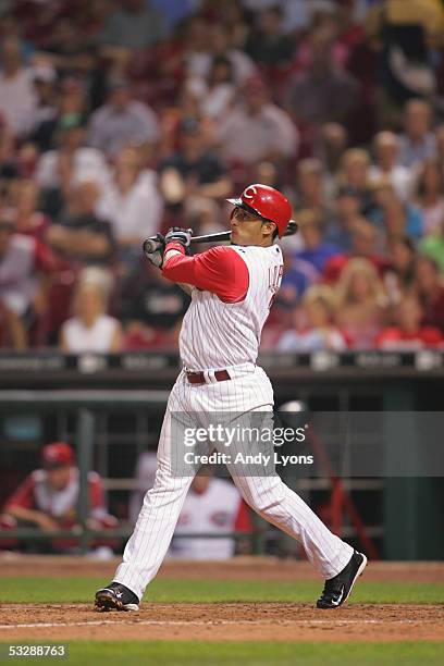 Infielder Felipe Lopez of the Cincinnati Reds swings at a pitch against the Colorado Rockies during the MLB game on July 16, 2005 at Great American...