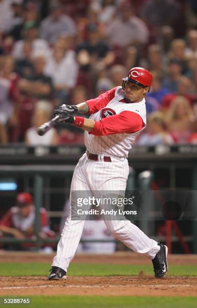 Infielder Felipe Lopez of the Cincinnati Reds swings at a pitch against the Colorado Rockies during the MLB game on July 16, 2005 at Great American...
