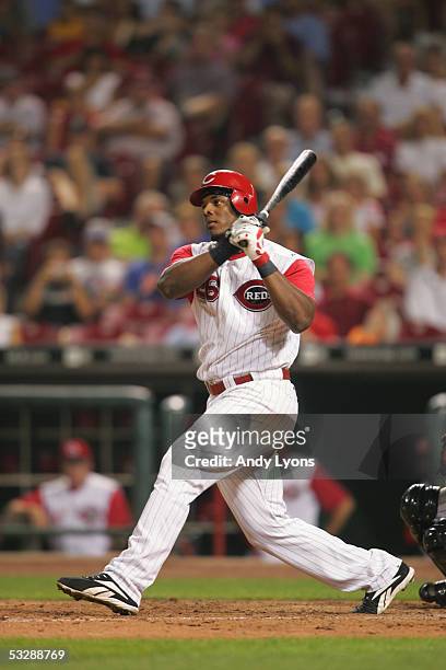Outfielder Wily Mo Pena of the Cincinnati Reds follows through on a hit against the Colorado Rockies during the MLB game on July 16, 2005 at Great...