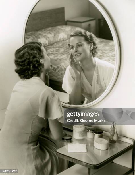 elevated view of woman sitting at vanity - finger waves stockfoto's en -beelden