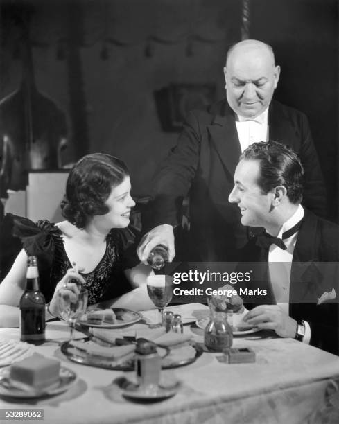 couple being waited on at restaurant - 1950s restaurant stock pictures, royalty-free photos & images