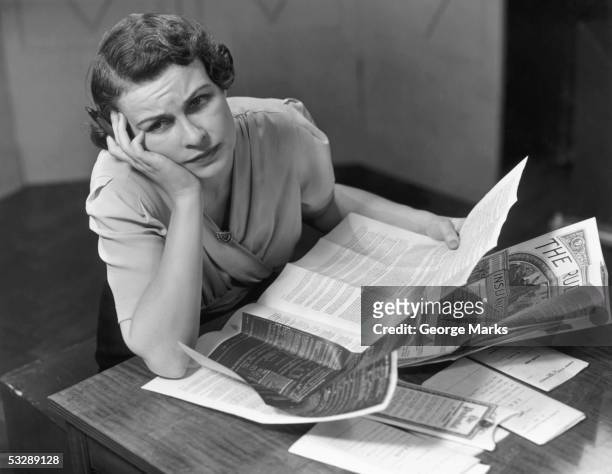 woman filling out insurance papers - stuck in the past stock pictures, royalty-free photos & images