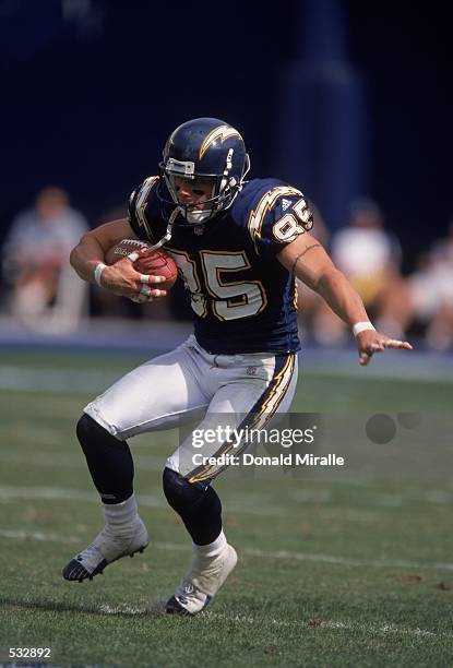 Tim Dwight of the San Diego Chargers carries the ball as he scrambles up the field during the game against the Denver Broncos at Qualcomm Stadium in...