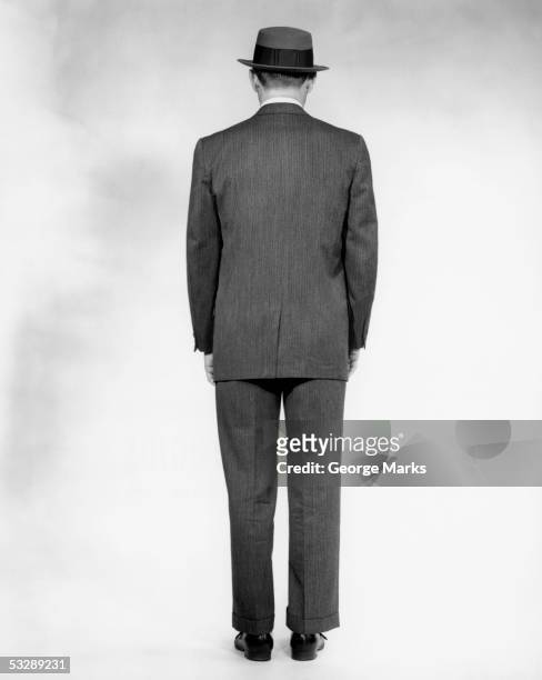 rear view of man in suit - hat and suit stock pictures, royalty-free photos & images
