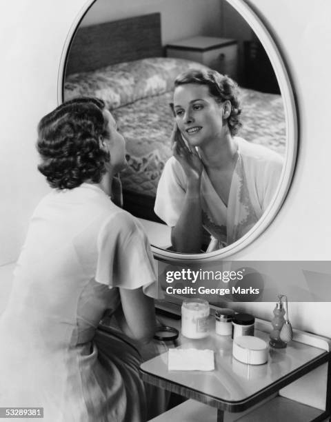 woman sitting at vanity and staring at r - 1950s bedroom stock pictures, royalty-free photos & images