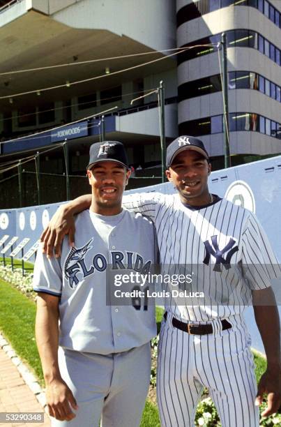 Orlando Hernandez of the New York Yankees poses with his half brother Livan Hernandez of the Florida Marlins at Yankee Stadium in the Bronx, New...