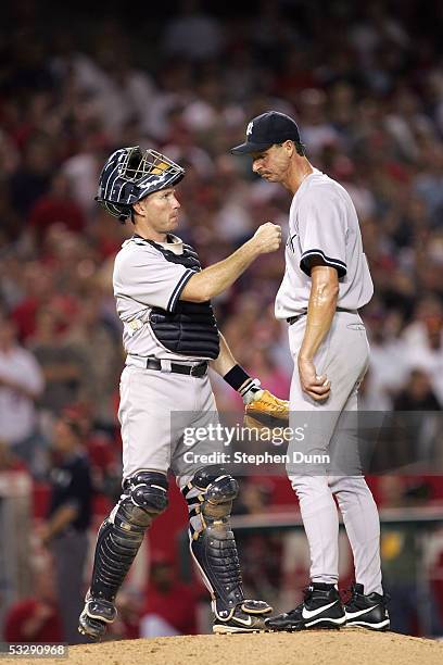 John Flaherty ANAHEIM, CA Randy Johnson of the New York Yankees talk it over during the game with the Los Angeles Angels of Anaheim on July 21, 2005...