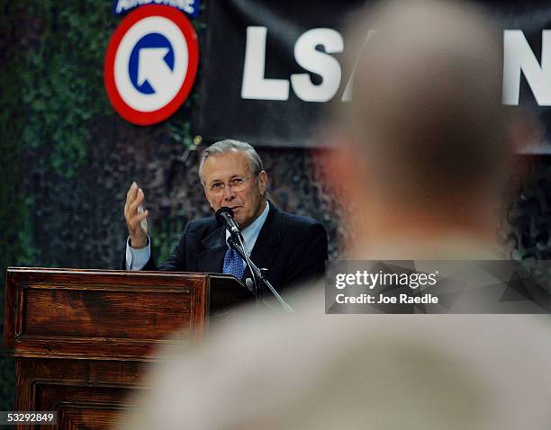 Secretary of Defense Donald Rumsfeld answers a question from a U.S. Army soldier during a town hall-style meeting July 27, 2005 at the Balad airbase...