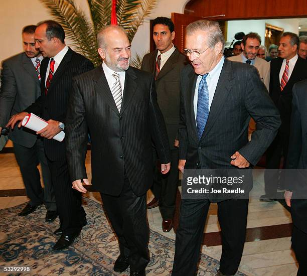 Iraqi Prime Minister Ibrahim al-Jaafari walks with U.S. Secretary of Defense Donald Rumsfeld to a meeting July 27, 2005 in Baghdad, Iraq. Rumsfeld is...