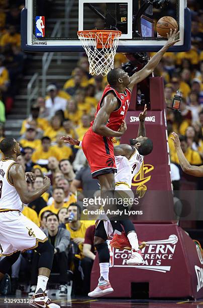 Bismack Biyombo of the Toronto Raptors blocks a shot by Kyrie Irving of the Cleveland Cavaliers during the first half in game two of the Eastern...