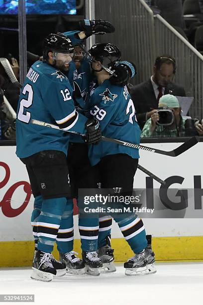 Joonas Donskoi of the San Jose Sharks celebrate his goal against the St. Louis Blues with Patrick Marleau and Logan Couture in game three of the...