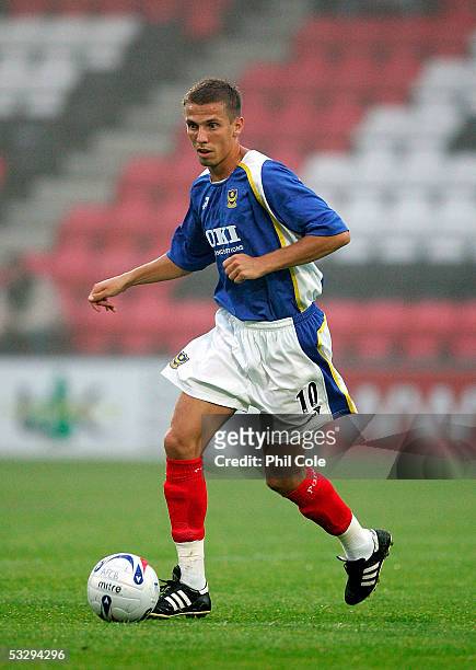 Gary O'Neil of Portsmouth moves the ball during a pre-season friendly match between Bournemouth and Portsmouth at the Fitness First Stadium on July...