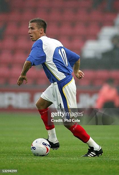 Gary O'Neil of Portsmouth moves the ball during a pre-season friendly match between Bournemouth and Portsmouth at the Fitness First Stadium on July...