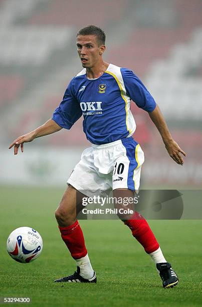 Gary O'Neil of Portsmouth moves the ball during a pre-season friendly match between Bournemouth and Portsmouth at the Fitness First Stadium on July...