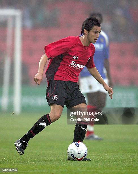 Brian Stock of Bournemouth moves the ball during a pre-season friendly match between Bournemouth and Portsmouth at the Fitness First Stadium on July...