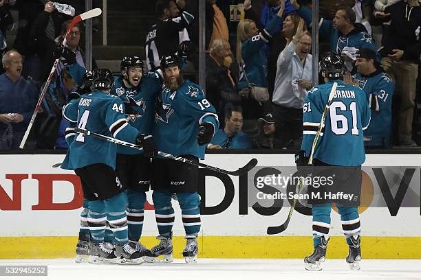 Tomas Hertl of the San Jose Sharks celebrates with Justin Braun, Marc-Edouard Vlasic, Joe Pavelski and Joe Thornton after his second goal in game...