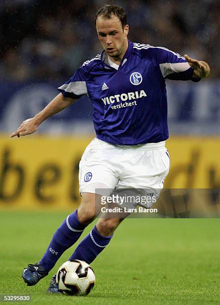 Fabian Ernst of Schalke runs with the ball during the Premiere Liga Cup match between FC Schalke 04 and Werder Bremen on July 27, 2005 in...