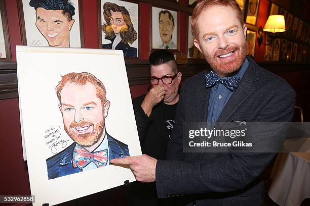 Jesse Tyler Ferguson with a Lea Delaria photobomb gets his caricature unveiled for his work in Broadway's "Fully Committed at Sardi's on May 19, 2016...