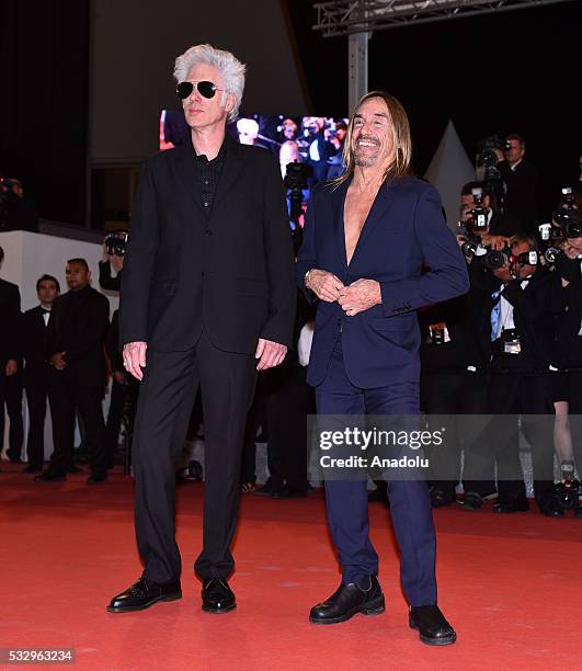 Singer Iggy Pop and US director Jim Jarmusch arrive for the film 'Gimme danger' at the 69th international film festival in Cannes on May 19, 2016.