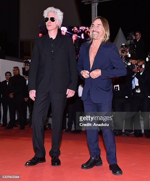 Singer Iggy Pop and US director Jim Jarmusch arrive for the film 'Gimme danger' at the 69th international film festival in Cannes on May 19, 2016.