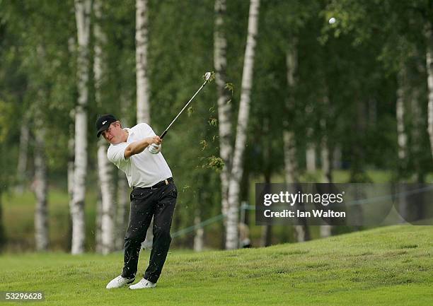 Pierre Fulke of Sweden plays his second shot on the 9th hole during round one of the Scandinavian Masters on the PGA European Tour at the Kungs?ngen...