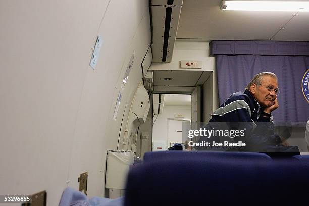 Secretary of Defense Donald Rumsfeld speaks to reporters July 27, 2005 as he flies back to America from a swing through Central Asia and Iraq....