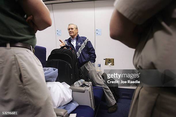 Secretary of Defense Donald Rumsfeld speaks to reporters July 27, 2005 as he flies back to America from a swing through Central Asia and Iraq....