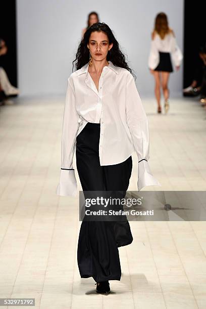 Model walks the runway in a design by Anna Quan at the St.George Project NextGen show at Mercedes-Benz Fashion Week Resort 17 Collections at...