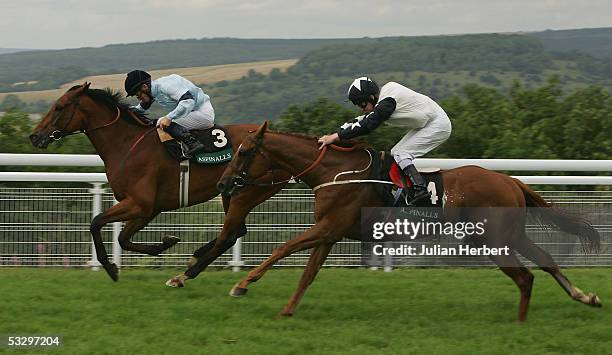 Mick Kinane and Distinction hold of the challenge of the Joe Fanning ridden Golden Quest to land The Lady O Goodwood Cup Race run at Goodwood...