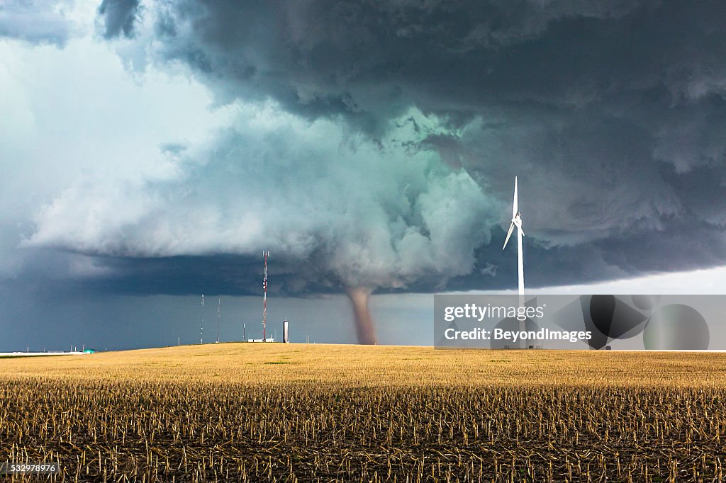 Dangerous tornado with wind generator and communications towers