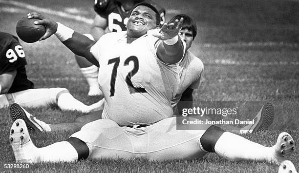 1980s: William Perry of the Chicago Bears throws the ball during a circa 1980s Training Camp at the University of Wisconsin-Platteville in...