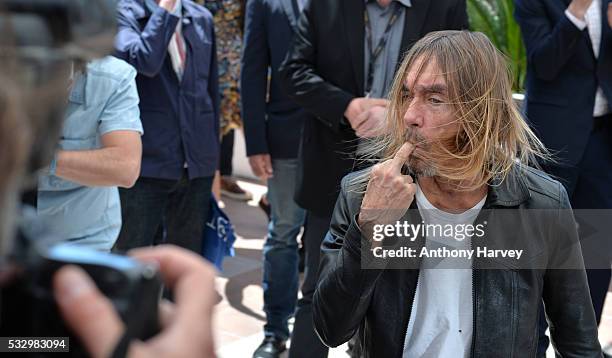 Iggy Pop gestures as he attends the 'Gimme Danger' Photocall at the annual 69th Cannes Film Festival at Palais des Festivals on May 19, 2016 in...