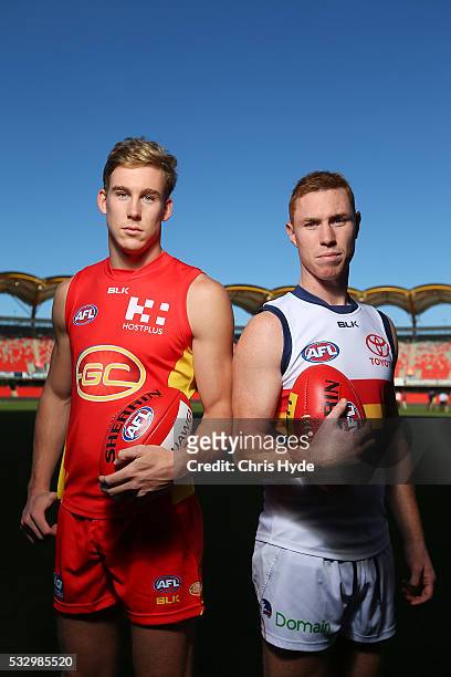 Tom Lynch of the Suns and Tom Lynch of the Crows pose for a photograph at Metricon Stadium on May 20, 2016 in Gold Coast, Australia.