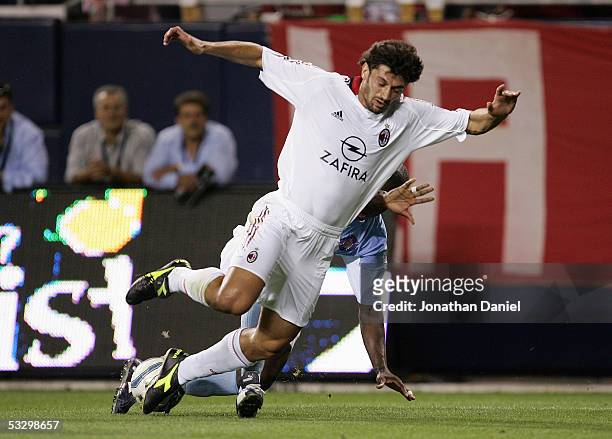 Samuel Caballero of the Chicago Fire tackles Kahka Kaladze of AC Milan during a friendly match on July 27, 2005 at Soldier Field in Chicago,...