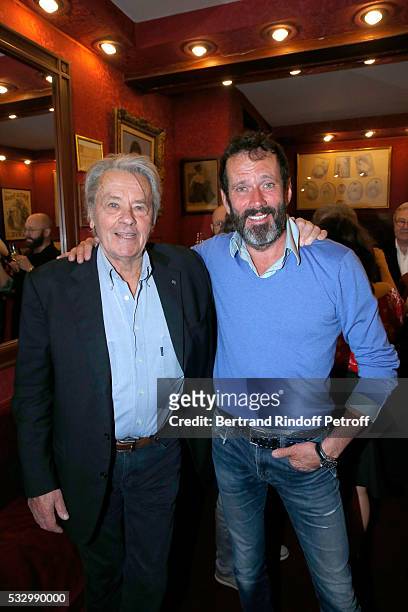 Alain Delon and actor of the piece hristian Vadim attend the 100th representation of the Theater piece "Un nouveau depart" at Theatre Des Varietes on...
