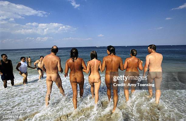 Friends skinny dip together on July 12, 2003 in the ocean off Gunnison Beach, Sandy Hook in Gateway National Recreational Area, New Jersey. Gunnison...