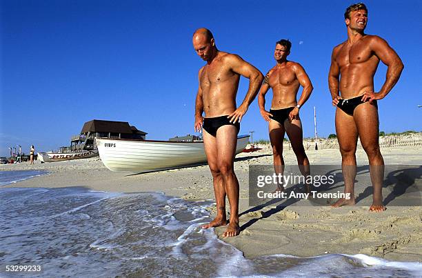 Members of the Ortley Beach lifeguard team waits for team members to return with a row boat while training for an upcoming lifeguard competition July...