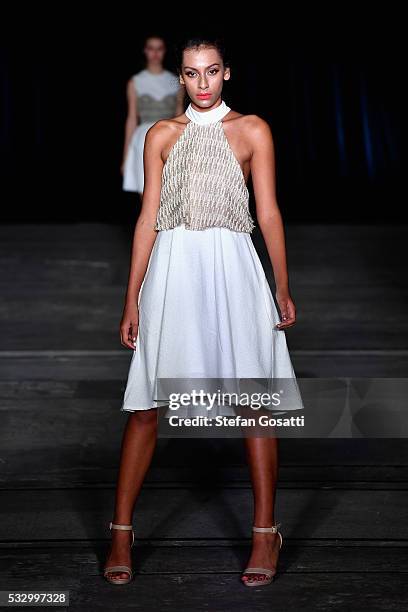 Model walks the runway in a design by Marika Deku at the Pacific Resort show at Mercedes-Benz Fashion Week Resort 17 Collections at Carriageworks on...