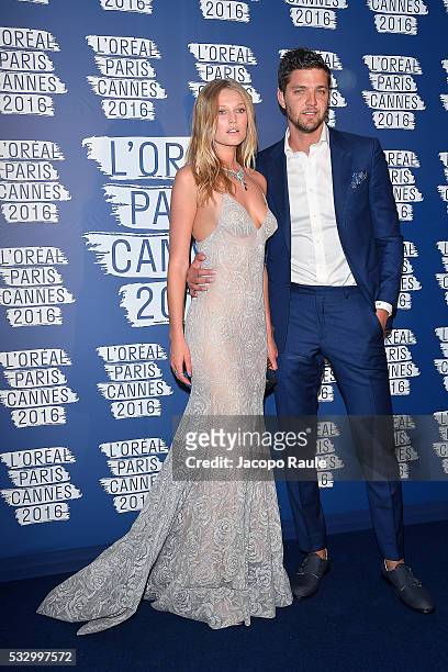 Toni Garrn and Chandler Parson attend the L'Oreal Paris Blue Obsession Party during the 69th annual Cannes Film Festival on May 18, 2016 in Cannes,...