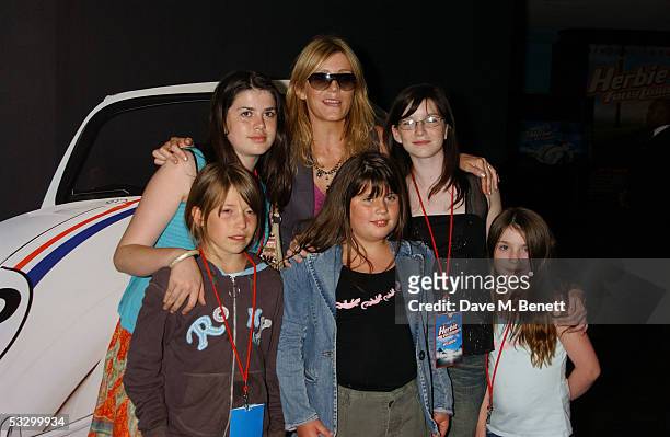 Michelle Collins and guests pose while they arrive at the UK Premiere of "Herbie: Fully Loaded" at Vue West End on July 28, 2005 in London, England.
