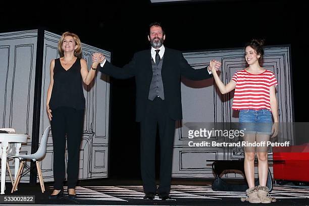 Actors Corinne Touzet, Christian Vadim and Fanny Guillot acknowledge the applause of the audience at the end of the 100th representation of the...