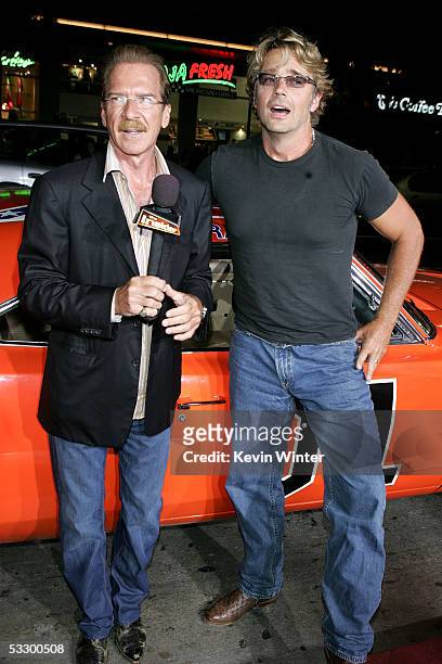 The Insider TV personality Pat O'Brien interviews actor John Schneider as he arrives at the Premiere Of "The Dukes of Hazzard" at the Grauman's...