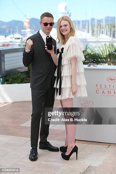 Director Nicolas Winding Refn and actress Elle Fanning attend "The Neon Demon" Photocall during the 69th annual Cannes Film Festival at the Palais...