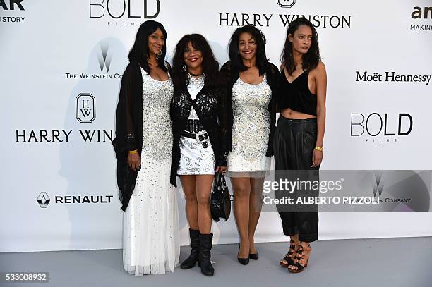 The members of the US band Sister Sledge Debbie, Joni and Kim and her daughter Julie Allen pose as they arrive for the amfAR's 23rd Cinema Against...